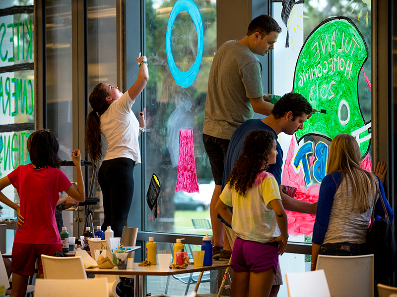 Students paint window for Homecoming
