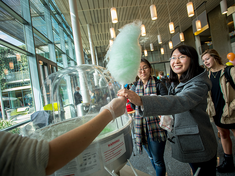 Students enjoy cotton candy in the LBC